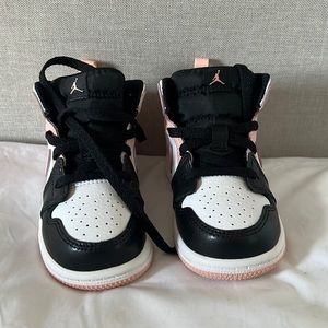 Black and pink Jordan 1s.